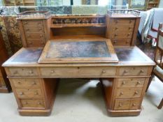 Mahogany leather inlaid bureau style pedestal desk. The Galleried back with eight secure locking