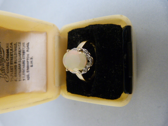 9ct Yellow Gold milky opal and diamond ring. The oval opal measures approx 10mm x 8mm with subtle - Image 4 of 6