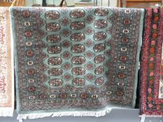 Green ground handwoven Bokhara 174cm x 123cm