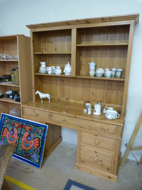 A Pine pedestal desk with bookcase over