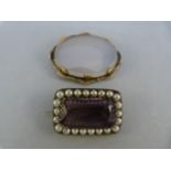Two victorian brooches - 1 Amethysty and pearl brooch marked 900 approx 31.36mm x 21mm. The other an