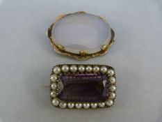 Two victorian brooches - 1 Amethysty and pearl brooch marked 900 approx 31.36mm x 21mm. The other an