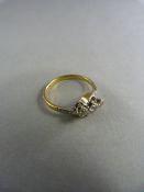 18ct Yellow gold diamond crossover ring set with three diamonds. Gross weight 2.6g