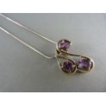 Silver contemporary pendant set with three amethysts Gross weight 12.6g