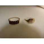 Hallmarked silver ring and one other set with Garnets