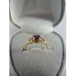 Childs 10K yellow gold Amethyst coloured ring Size F - UK 2.15 USA Gross weight 0.8g