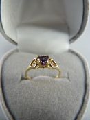 Childs 10K yellow gold Amethyst coloured ring Size F - UK 2.15 USA Gross weight 0.8g