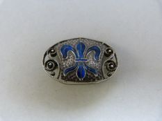 Oval enamel Murle Bennett brooch (early mark about 1910) with enamel 'Fleur-de-Lyre' in blue enamel.