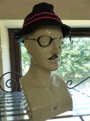 Modern china hat rest with tash and glasses