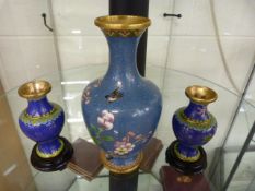 Pair of blue ground Cloisonne vases and a Larger blue Cloisonne vase depicting flowers