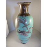 An oriental Cloisonne Turquoise ground vase - decorated with dragons, some losses and damage - to