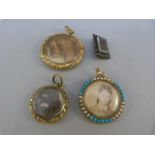 Box containing mourning pendants and a brooch. The largest is 32.1mm in diameter, smallest 22.6mm in