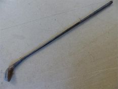 Believed to be a very rare Hickory shafted 'Scarce' Head golf club with lead insert to rear, metal