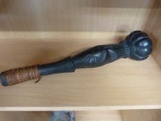 A Fijian Ula throwing club heavily carved and lacquered with string handle