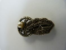 Silver Marcasite and a 5.5mm Cultured pearl dress clip approx 33mm long x 18.5mm at the Widest part