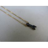 9ct Gold black onyx cupids arrow pendant approx 15mm x 4.75mm wide on a 15" chain Gross weight 1.7g