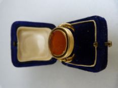 Unmarked but high carat (22-24ct) Greco Roman seal ring. The Oval cornelian is set into an approx