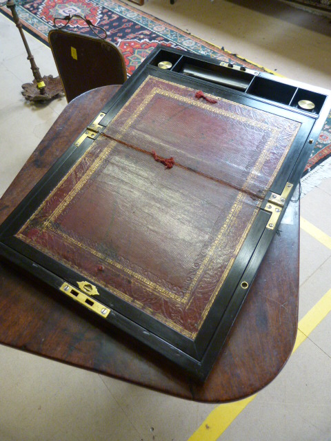 Rosewood and heavily brass inlaid campaign writing slope with two brass handles sitting flush to the