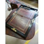 Rosewood and heavily brass inlaid campaign writing slope with two brass handles sitting flush to the