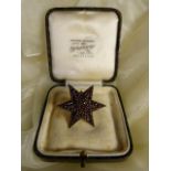 Victorian Bohemian Garnet Double level Star Brooch measuring approx: 38.2mm across point to point.