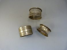 Three napkin Rings - two hallmarked silver (weight - 23g)