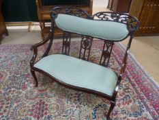 Unusual Mahogany framed two seater hall bench with green upholstered seats. With shaped top,