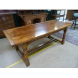 Golden oak french refectory farmhouse style table. The top formed of three panels sitting on heavy