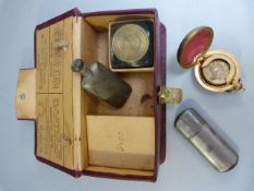 Box containing a sovereign holder and a two small trinket pieces