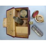 Box containing a sovereign holder and a two small trinket pieces