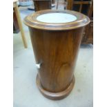 Fine example of a Victorian Mahogany pot cupboard of cylindrical form with marble inset, opening