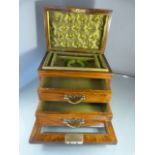 Rosewood and Glass jewellery box. Drop down front bearing bevelled glass panel leading to two