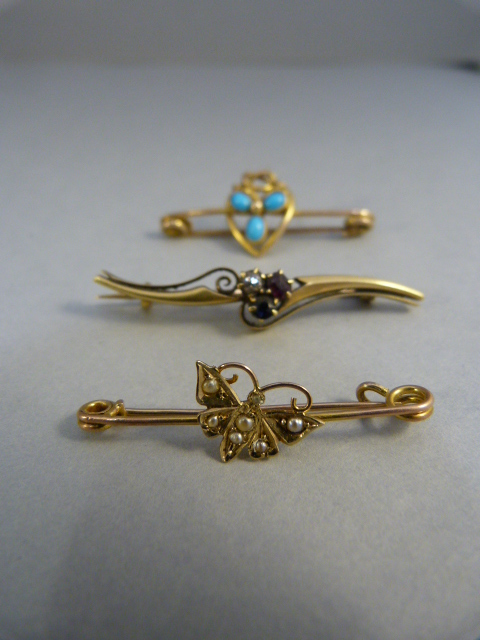 Three Gold bar brooches: 1 x 9ct (1931 Chester Hallmark) butterfly brooch set with Seed Pearls,