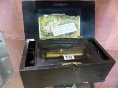 A National Musical box number 30801 with 6 1/4 inch cylinder playing six airs in a grained case. All