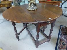 Oak gate leg table with single drawer