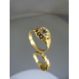18ct Gold ring with central Sapphire gemstone and surrounded by a circle of diamonds