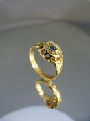 18ct Gold ring with central Sapphire gemstone and surrounded by a circle of diamonds