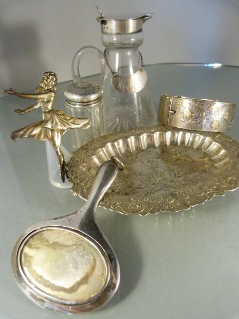Collection of silver items to include a silver bangle, mirror, brooch and silver topped glass