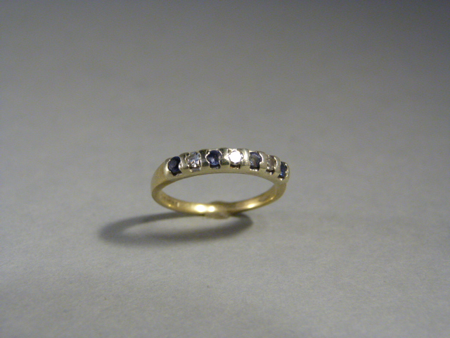 Sapphire and Diamond half hoop eternity ring. Set with 4 small pale blue sapphires and 4 small 8 cut - Image 2 of 3