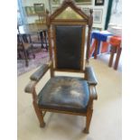 Heavy carved Oak framed Lodge chair with leather arms and seat padded with horse hair. Brass