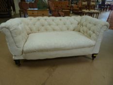 Cream upholstered button back chesterman on oak castor feet