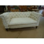 Cream upholstered button back chesterman on oak castor feet