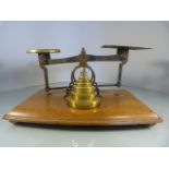 Set of Brass Postage scales sat on an oak base with full set of brass weights - To one of the