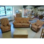 Ercol Three piece suite in darkwood with red floral upholstered cushions