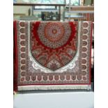 Red ground handwoven silk rug with medallion design 175cm x 118cm