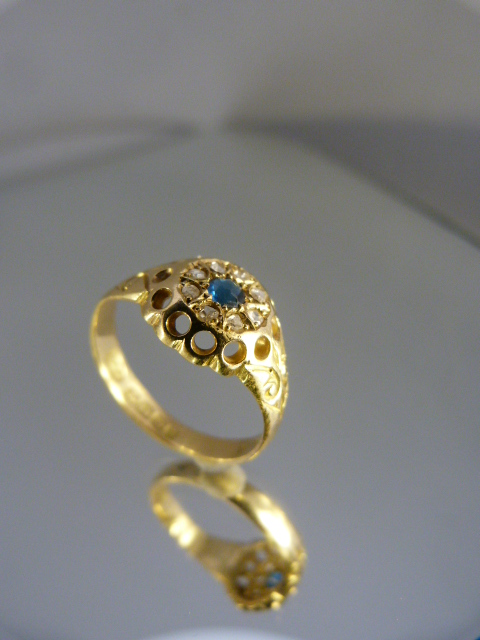 18ct Gold ring with central Sapphire gemstone and surrounded by a circle of diamonds - Image 2 of 2