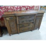 Mahogany Breakfront sideboard with Art nouveau decorated drawers flanked by two drawers