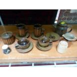 Collection of David Winkley Vellow pottery - tea set and jars with covers