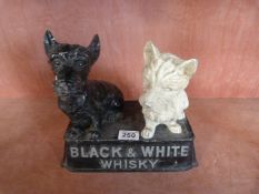 Buchanans cast iron Whisky dogs sat on rectangular plinth "Black and White Whisky"