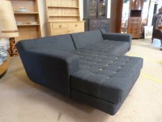 Modern modular L-shaped sofa by 'Naughtone' in grey felt with yellow buttons and chrome legs