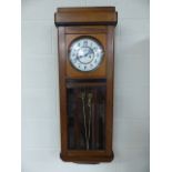 Antique wall clock possibly American (weights and pendulum in office). Approx 95cm H